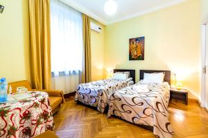 Postel nebo postele na pokoji v ubytování V Park Hotel