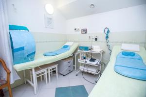 Ένα ή περισσότερα κρεβάτια σε δωμάτιο στο Hotel Sanatorium Mariot