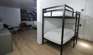 Rúm í herbergi á Hotel & Restaurant Forni