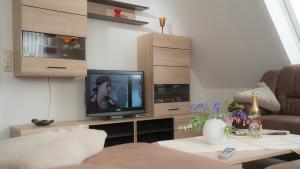 TV a/nebo společenská místnost v ubytování Mehr -Nordseeurlaub