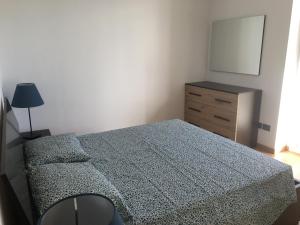Łóżko lub łóżka w pokoju w obiekcie VILLA DEGLI ULIVI