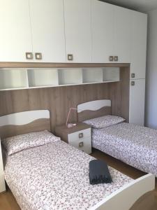 Łóżko lub łóżka w pokoju w obiekcie VILLA DEGLI ULIVI