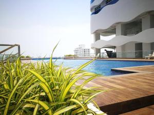 a swimming pool on the side of a cruise ship at ExcluSuites Malacca @ The Wave Residence in Malacca