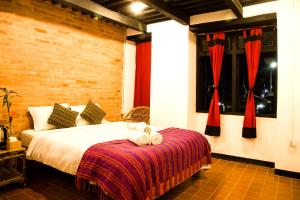 Cama o camas de una habitación en Lumbini Heritage Home