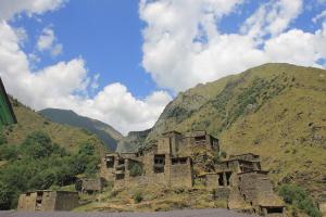 an old building on the side of a mountain at Shatili ( Green House ) in Shatili