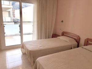 Кровать или кровати в номере Apartamentos Benet
