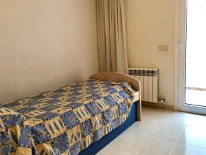 Кровать или кровати в номере Apartamentos Benet