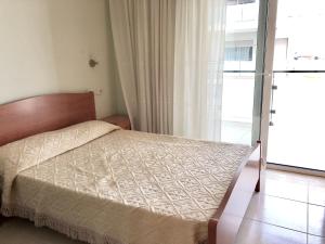 Кровать или кровати в номере Apartamentos Benet