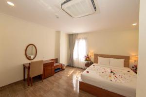 Postel nebo postele na pokoji v ubytování Trường Hải Hotel