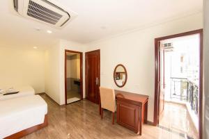 Postel nebo postele na pokoji v ubytování Trường Hải Hotel