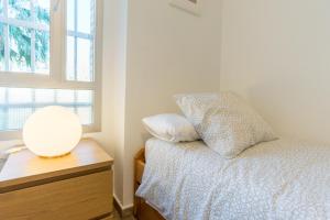 Postel nebo postele na pokoji v ubytování Sweethome El Palo