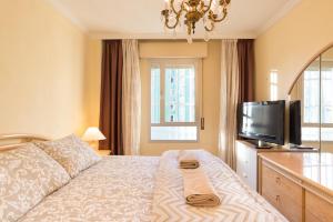 Postel nebo postele na pokoji v ubytování Sweethome El Palo