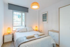 Postel nebo postele na pokoji v ubytování Sweethome El Palo