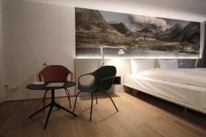 Rúm í herbergi á Hotel & Restaurant Forni