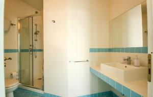 a bathroom with a sink and a shower and a toilet at Meravigliosa casa con vista Tropea in Santa Domenica