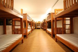 Postel nebo postele na pokoji v ubytování A&A Garden Suites