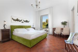 Postel nebo postele na pokoji v ubytování Villa Oriana Relais