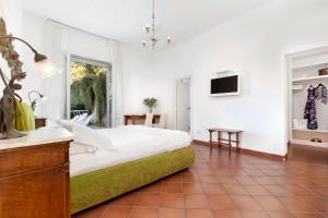 Postel nebo postele na pokoji v ubytování Villa Oriana Relais