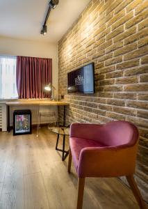 TV a/nebo společenská místnost v ubytování Level Luxury Suites + 24 fotografií
