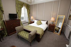 A bed or beds in a room at Rothley Court Hotel by Greene King Inns