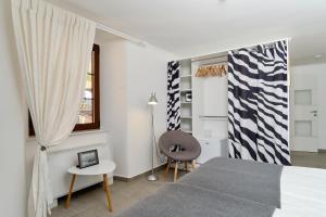 Postel nebo postele na pokoji v ubytování Apartments Zebra