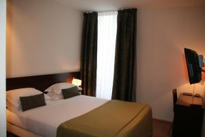 Postel nebo postele na pokoji v ubytování Hotel La Beauze