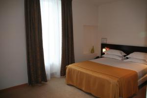 Postel nebo postele na pokoji v ubytování Hotel La Beauze