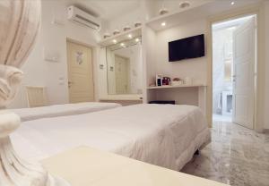 Posteľ alebo postele v izbe v ubytovaní FLOS Guest House