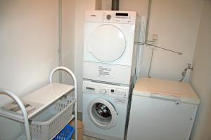a washing machine and a washer in a room at Apartment 9 in Heiligenhafen
