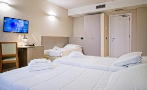 Ένα ή περισσότερα κρεβάτια σε δωμάτιο στο Albergo Papillon
