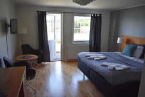Postel nebo postele na pokoji v ubytování Håveruds hotell och konferens