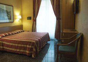 Postel nebo postele na pokoji v ubytování Hotel Agorà