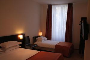 Postel nebo postele na pokoji v ubytování Hotel La Beauze