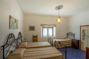 Ένα ή περισσότερα κρεβάτια σε δωμάτιο στο Residence Villa Elena