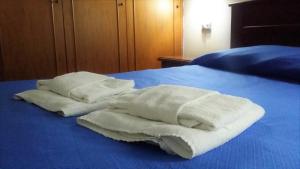 Postel nebo postele na pokoji v ubytování Guesthouse Holiday Formia beach