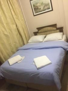 Postel nebo postele na pokoji v ubytování Paris Hotel