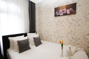 Postel nebo postele na pokoji v ubytování Hotel Flipper Amsterdam