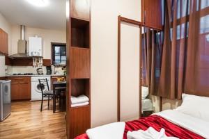a small apartment with a bed and a kitchen at Old Tbilisi Flavor for you2 in Tbilisi City