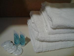 a pile of towels sitting next to a stack of towels at Old Tbilisi Flavor for you2 in Tbilisi City