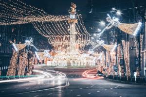a city lit up at night with christmas lights at Old Tbilisi Flavor for you2 in Tbilisi City
