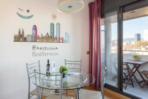 a dining room with a glass table and chairs at 1216 - Forum Gardens Apartment in Barcelona