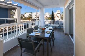 a balcony with a table and chairs on a balcony at Golden in Playa de Gandia