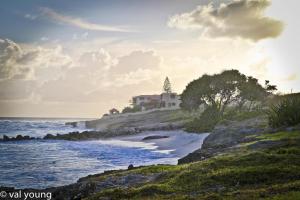 a house on an island in the ocean at Esaw Place in Christ Church