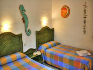 Кровать или кровати в номере Bungalows Los Melocotones
