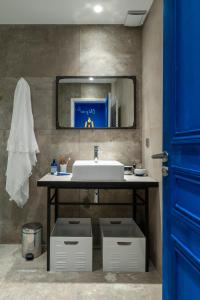 a bathroom with a sink and a mirror at TERRE DE REVE in Le Rouret