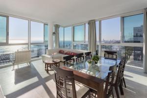 a living room with a table and a couch at 1410 - Mediterranean Forum Apartment in Barcelona +30 photos