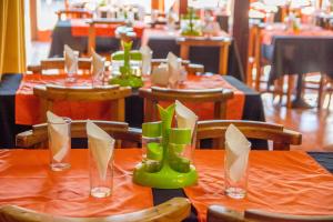 a table with green rubber boots on top of it at Apart Hotel Manantiales Termal in Termas del Daymán