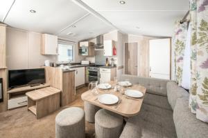 A kitchen or kitchenette at Trelawne Manor Holiday Park