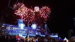 a fireworks display in front of a building at night at Barcaresa-RAVISSANT APPARTEMENT PISCINE VUE MER WIFI PARKING GRATUIT in Le Barcarès +45 photos