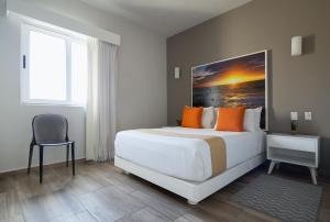 Postel nebo postele na pokoji v ubytování Azura Boutique Hotel